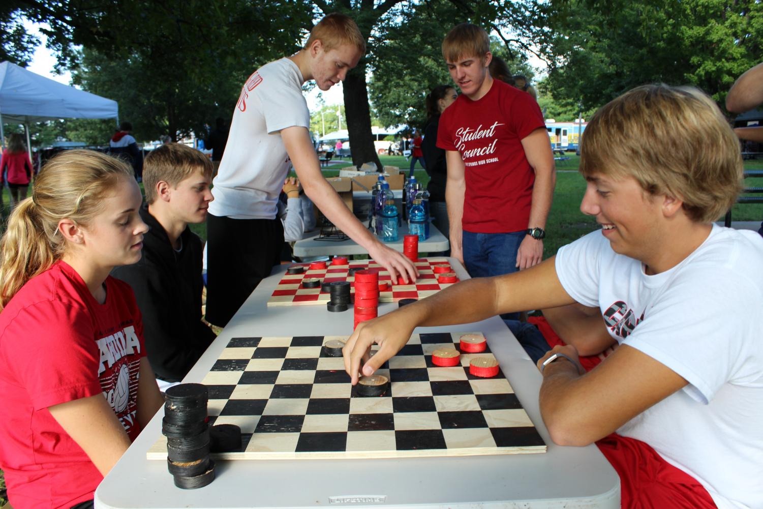 Seniors Makenzie Curry and Nathan Ohl play checkers after the Stand Down was over.