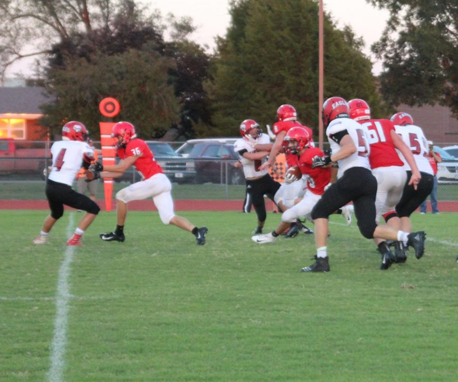 Senior Zach Mercer runs the ball and gets through the Eagles defense 