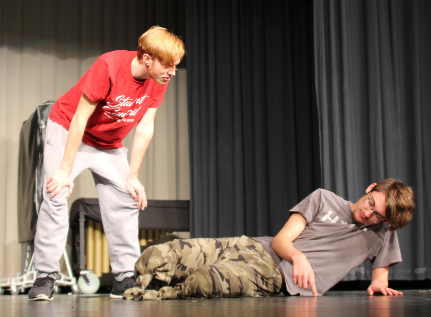 During play practice, Jimmy (senior Caden Runnalls) and Sam (senior Ben Doffing) have a discussion about whether or not to leave legless Doffing behind to sacrifice himself to the zombies so the others can escape.