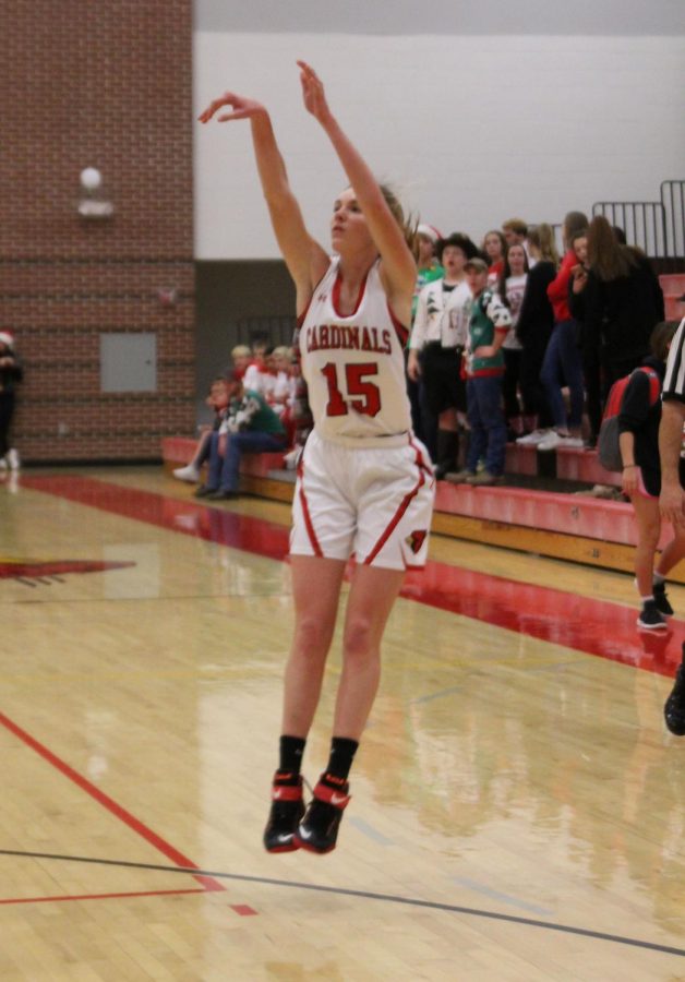 During the Chaparral basketball game Dec. 18, junior Kara Koester shoots a 3-pointer. The girls also had a high scoring game that game, which helped set Christmas break off with a positive start.
