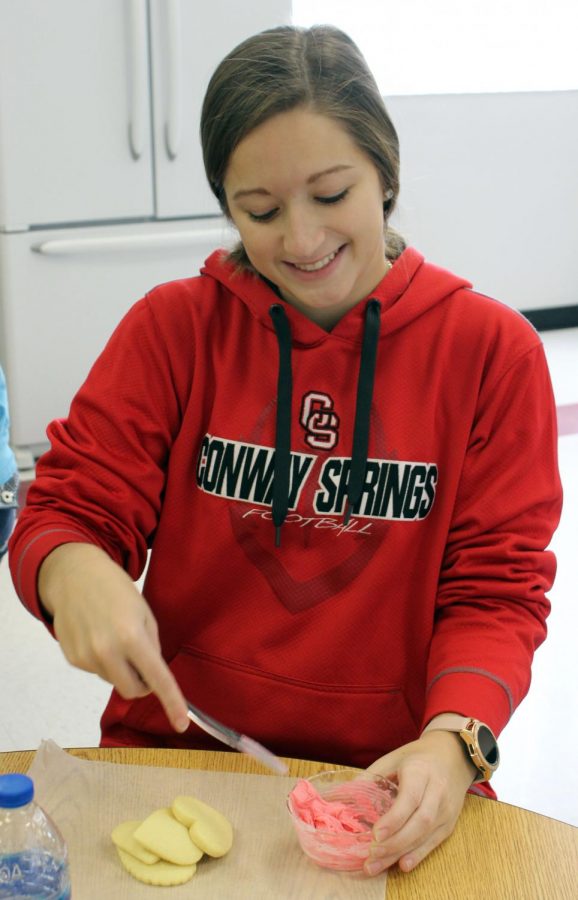 For the Valentine’s giveaway, senior Lesie Mies decorates heart-shaped cookies. This giveaway was hosted by the FCCLA group during FCCLA week.