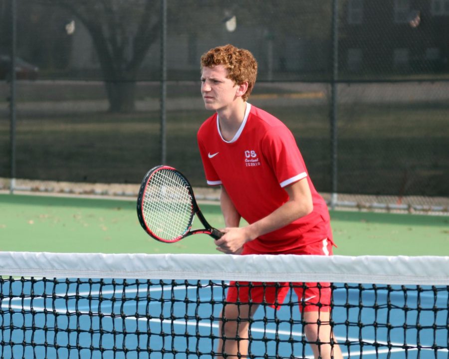 During the home varsity meet April 25, junior Cody Jones positions himself and prepares for the game to start. Jones played with his partner senior Dominic Pauly at this meet.