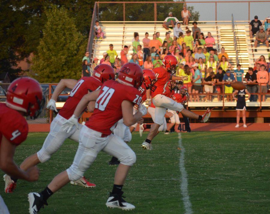 At the first home game, Cardinals vs the Knights, junior Cole Schulte kicks off the football to start the game. “I feel this season we will kick more PATs (points after touchdown) and our special teams will be more consistent,” said junior and varsity kicker Cole Schulte.
