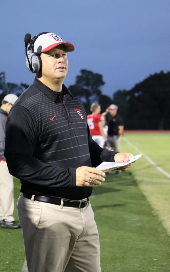 During the game against the Panthers Oct. 4, head coach Matt Biehler observes from the sidelines as the team closes in for a touchdown. This was Biehler’s most recent victory after reaching his 100th win as head coach of the Cardinals. 