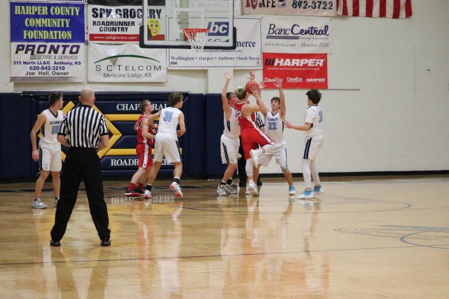 Junior Zach Osner scores a layup during the first round game against Clearwater during the Chaparral tournament Jan. 23. The boys lost the game 29-54.
