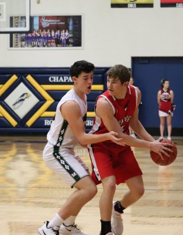 During the final game of the Chaparral tournament, junior Heath Hilger looks for an open player to pass the ball to. The boys placed sixth overall at the tournament after playing Clearwater, Sunrise Academy and Mulvane. 