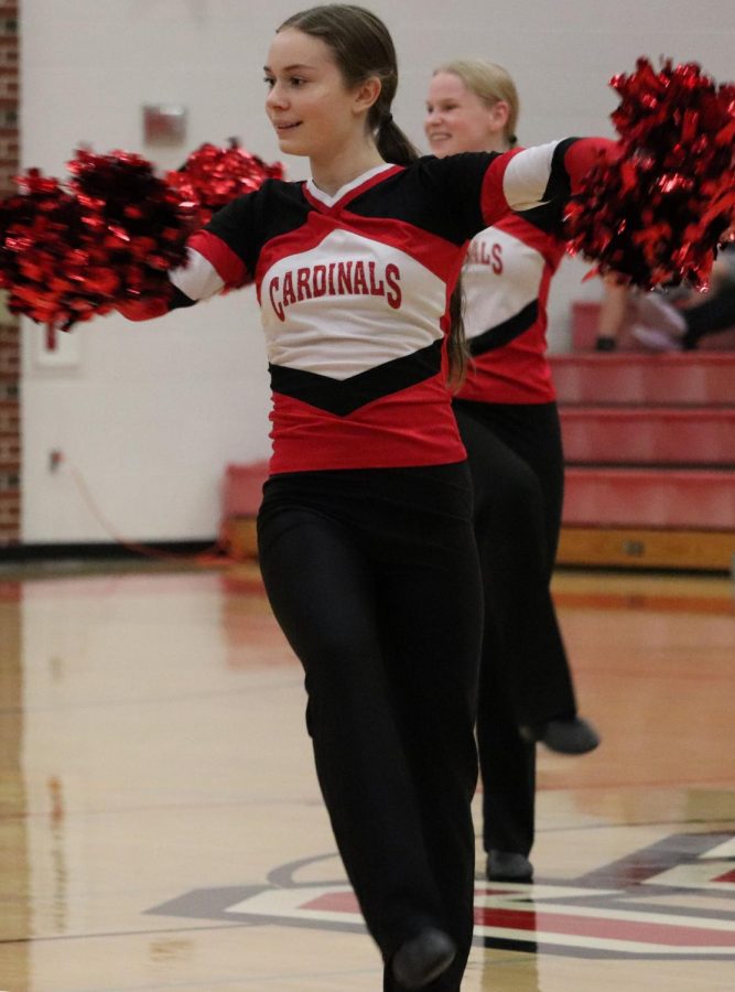 During halftime of the boys basketball game against Douglass, freshman Ava Schulte performs with the dance team. Schulte was one of the returning members of the dance team, along with several others.