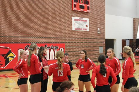 During a timeout, head coach April Zoglmann discusses a game plan for the varsity volleyball team. This took place Sept. 10 when the girls played Halstead.