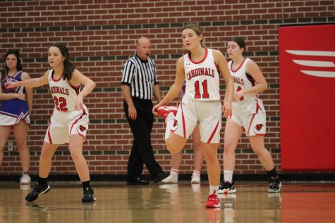 After losing the ball, junior Loren May and freshmen Gabby Dalbom and Haylee Osner prepare to play defense in the varsity girls basketball game against Cheney Dec. 4.

