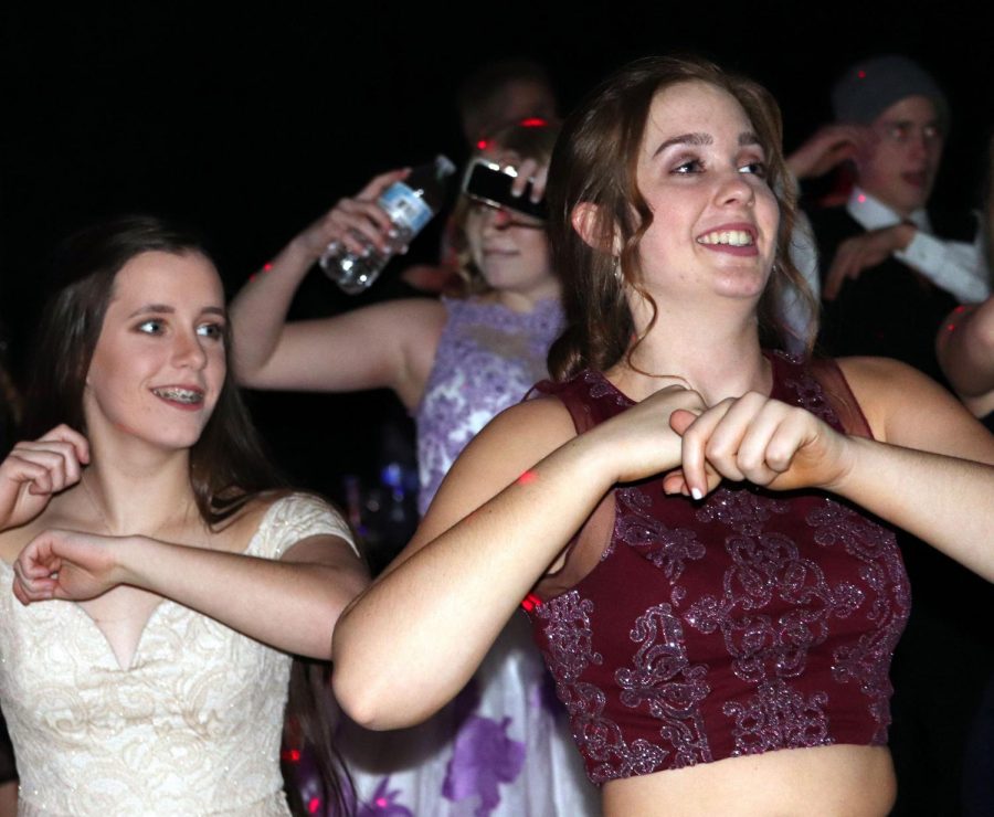 Juniors Lauren Mercer and Emily Heimerman dance at the Winter Formal in 2019. Plans for this year’s Winter Formal are still up in the air. 