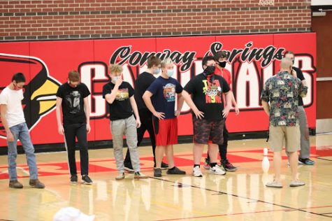 P.E. teacher Matt Biehler tells the sophomore team the rules for Castles as they prepare for the game. The sophomores lost to the seniors in the first round Feb. 2 during activity period. The freshmen also lost to the juniors.