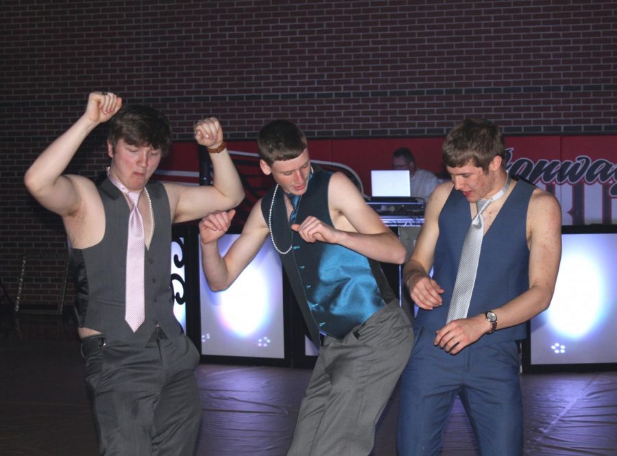 Junior Derek Osner, junior Lance Pauly, and senior Heath Hilger dance during Prom. The dance was from 8:30 to 10 p.m.