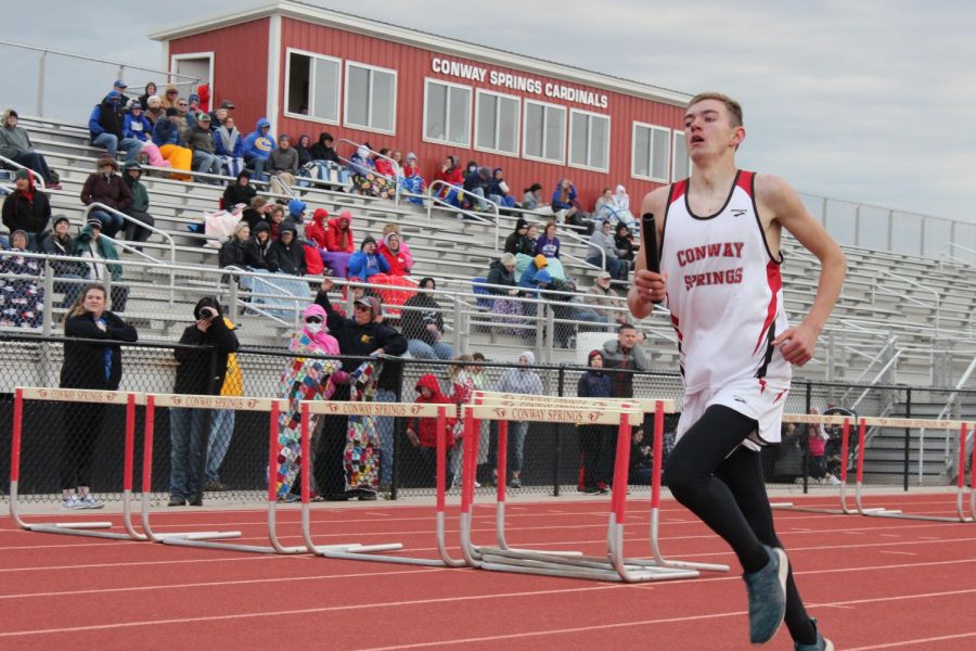 During the 4x800 meter relay, sophomore Zach Johnson sprints his last 100 meters before he hands the baton off to the next runner. This took place at the home track meet April 9. 