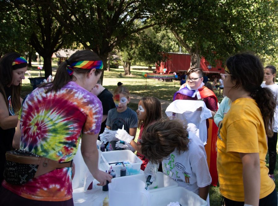 Attendees at the Pride Festival work on colorful tie-dye shirts. The event and all of the activities were sponsored by Conway Loves. 