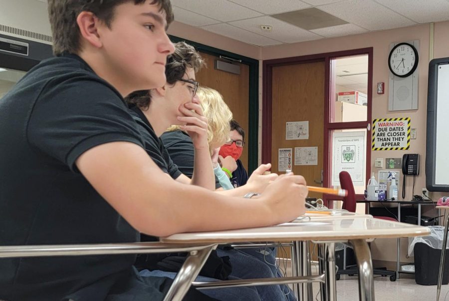 Freshmen Cooper Shobe and Levi Mies sit with their teammates during a round at the JV  Scholars Bowl meet. The meet was on Thursday last week at Mulvane.