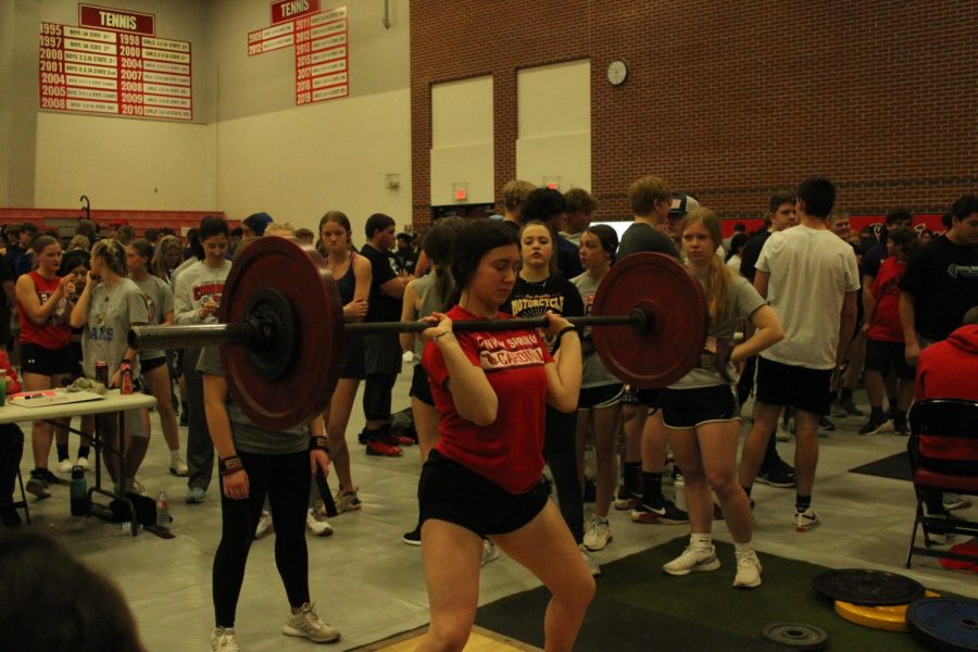 During the invitational lift, freshman Blair Fisher competes in clean. "I'm glad I know what to do next time," she said.