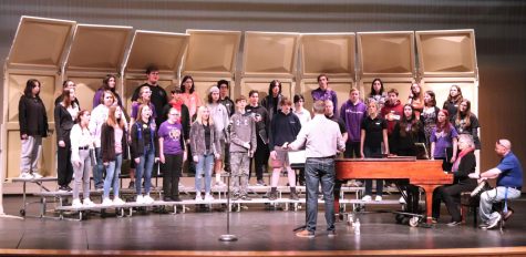 Students from the Central Plains League practice the choir pieces on stage before performing later that day. The choir practiced their song called “The Pasture.” 