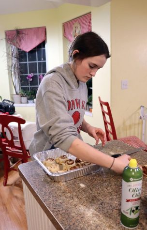 Junior Natalie Doffing makes cinnamon rolls to raise money for their NHS service project. She and senior Faith Stuhlsatz ended up with a total of 31 and half dozen batches.