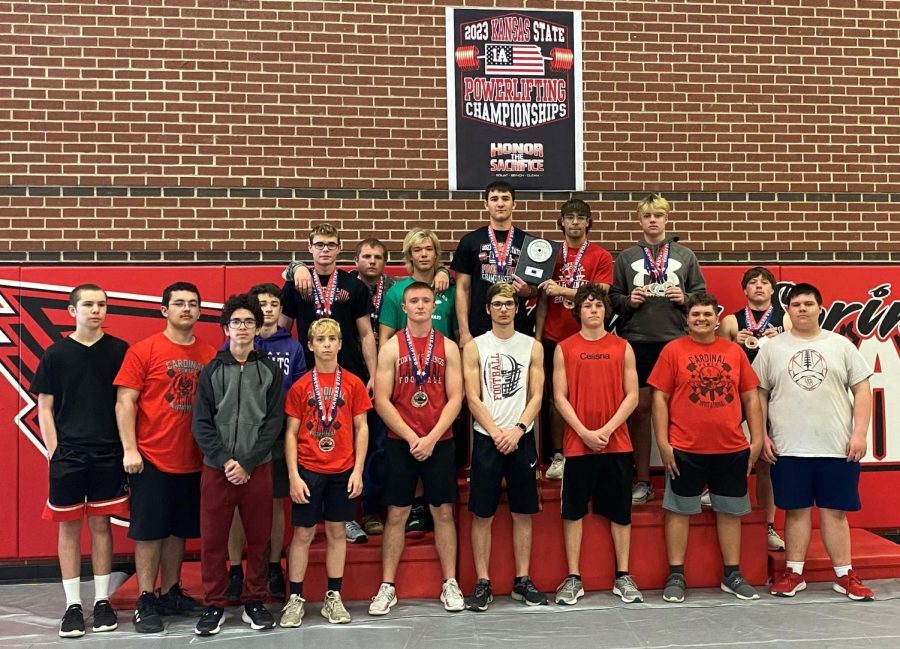 The mens powerlifting team poses for a photo at the end of the state meet. “There were lots of records broken by lots of schools, so that helped to make the day exciting,” athletic  director Matt Biehler said. 
