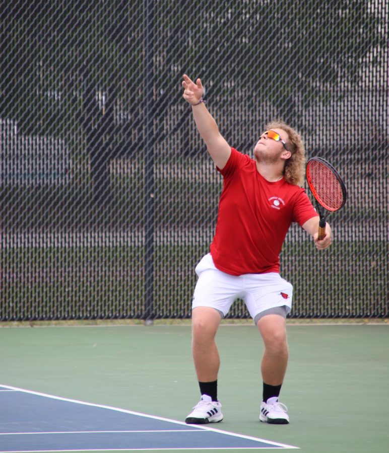 Senior+Bradyn+Stevens+serves+the+ball+to+his+opponents+May+5+at+Regional+Tennis.+Stevens+played+doubles+with+sophomore+Layne+Whitney.+