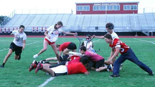 The sophomore class competes in table surfing in the Red and White Olympics. Sophomores took third in this game then tied for first overall in the games.
