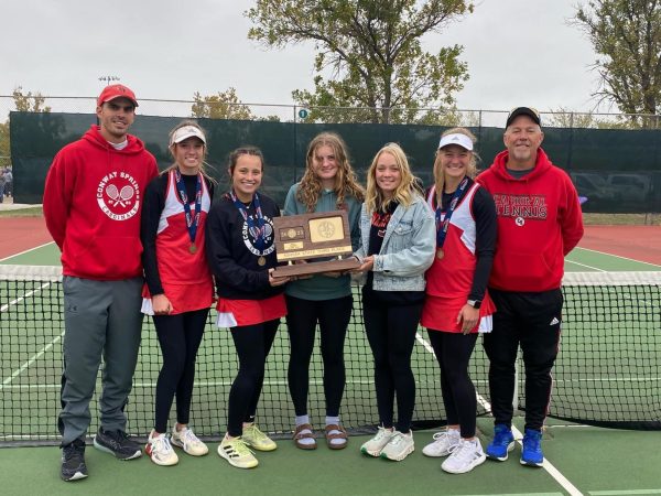 The girls tennis team poses with the third place trophy at state in Topeka. The team competed Oct. 13-14. Photo courtesy of the USD 356 facebook page. 
