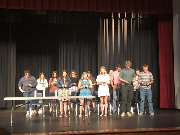The Honor Society members say the NHS pledge at the Induction Ceremony Sept. 27. NHS president Janel Meyer led this pledge. Photo courtesy of Lindsay Pauly
