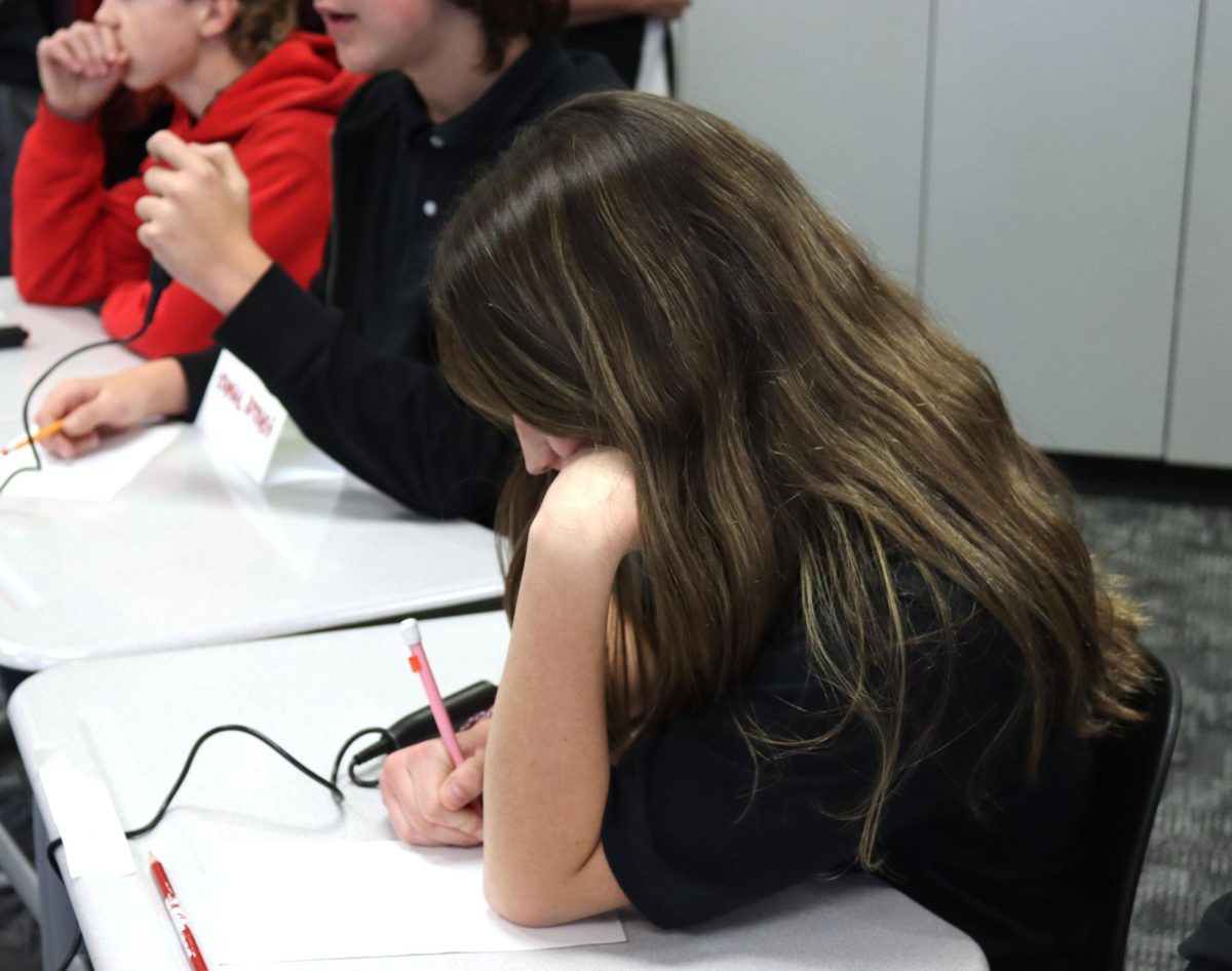 Freshman Addy Conkle works on one of the three math questions during the round against Medicine Lodge at the home JV meet Oct. 30. The team’s overall record for the meet was 5-1.
