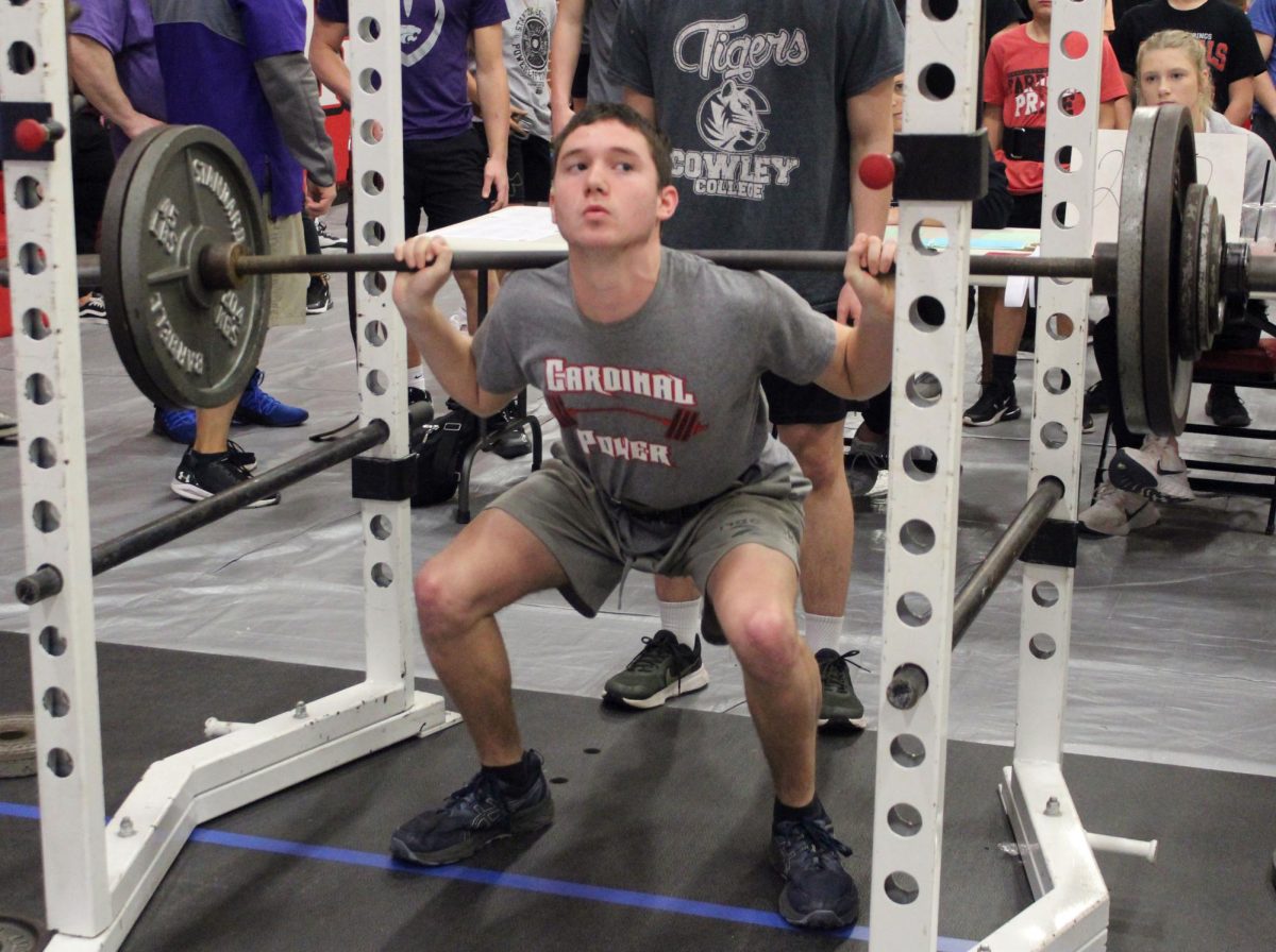 During+the+Invitational+Powerlifting+meet+March+9%2C+freshman+Joe+Howard+participates+in+squat.+Howard+placed+first+in+squat.
