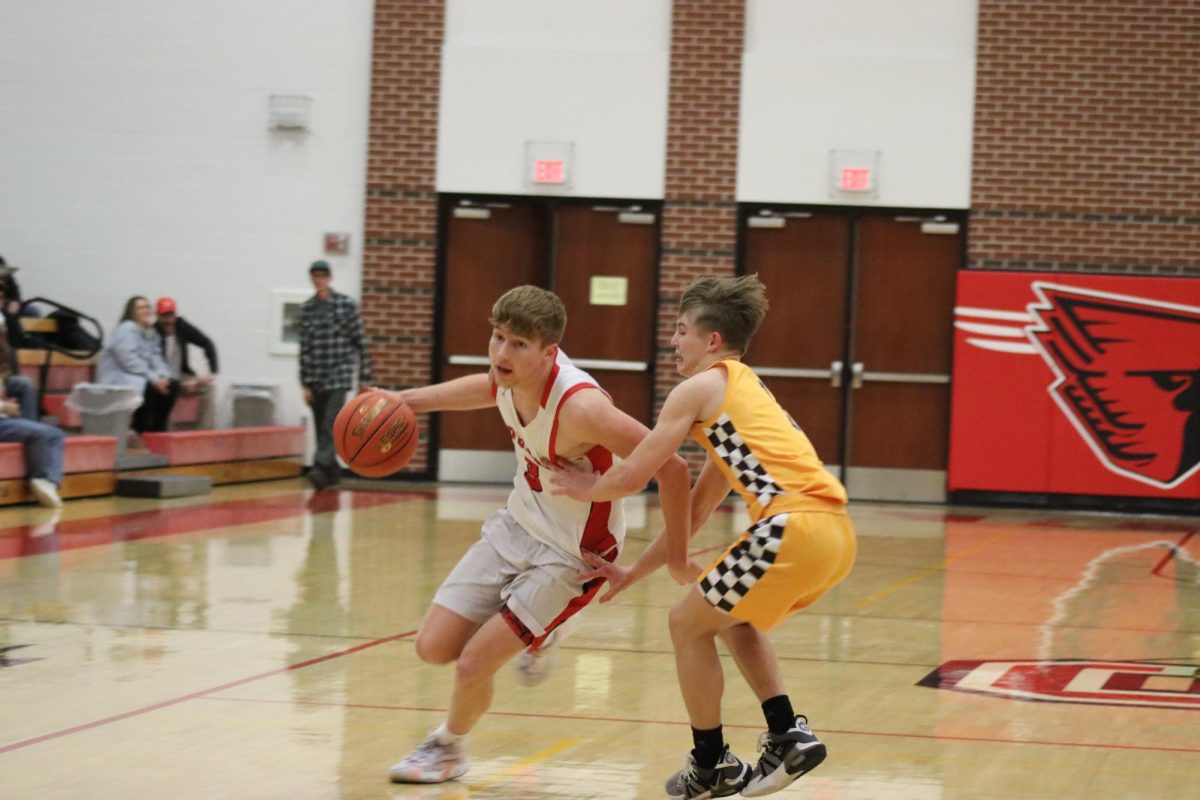 Senior Taylor Wykes takes the ball down the court during the first round of sub-state. Conway played Belle Plaine and won with a score of 62-40.
