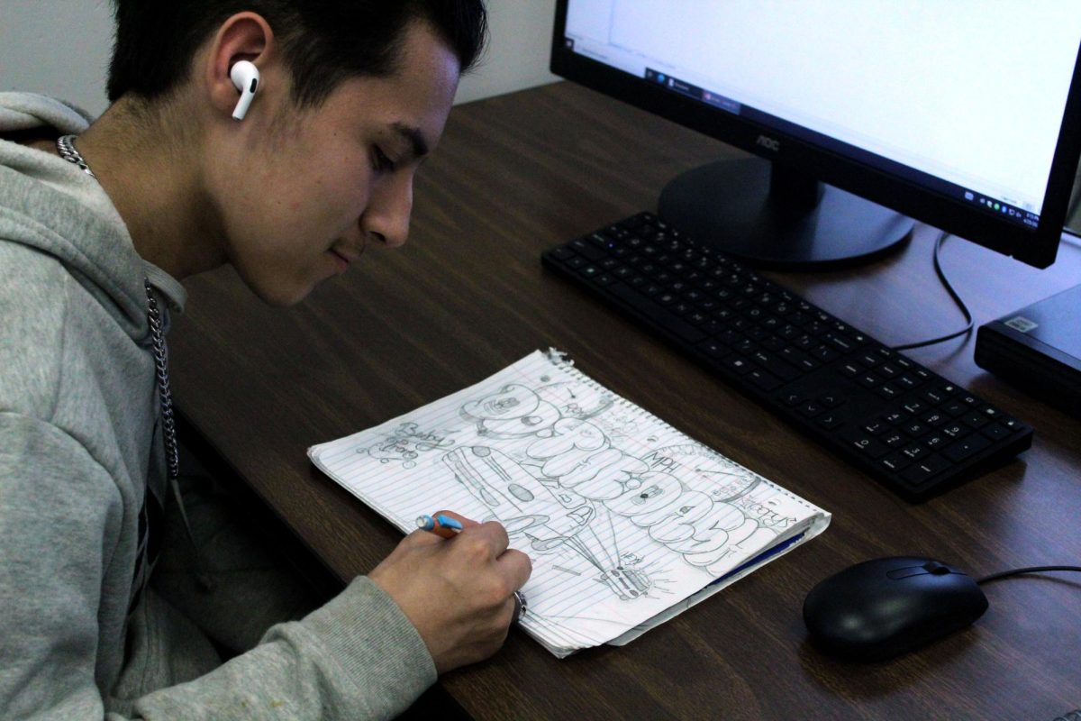 Freshman William Morataya draws in his last hour before going home. Morataya draws in his free time.
