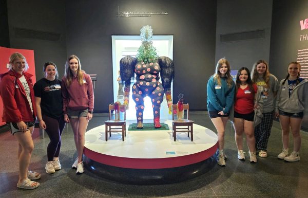 At the Wichita Art Museum April 17, sophomores Macie Hartman, Hayley Pauly, and Morgan Koester; freshmen Sophy Dalbom, Alyssa Vance, and Kelly Stuhlsatz; and sophomore Olivia Wood stand next to one of the students’ favorite sculptures.
Photo contributed by Jennifer Potts