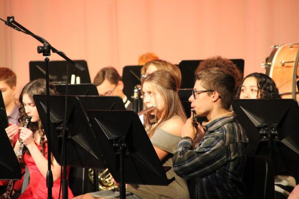 Junior Wyatt Harlan and sophomore Tabitha Wykes play a tuning note together before playing the group Christmas songs. Band works on pep band and concert band all throughout the year. 