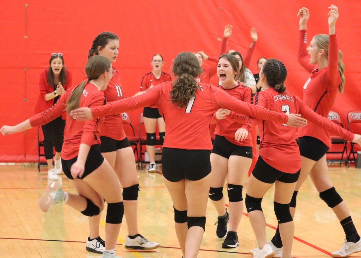 The JV players celebrate after they scored a point at the first home volleyball game. JV lost 2-3 in a best-of-five match against Independent.





