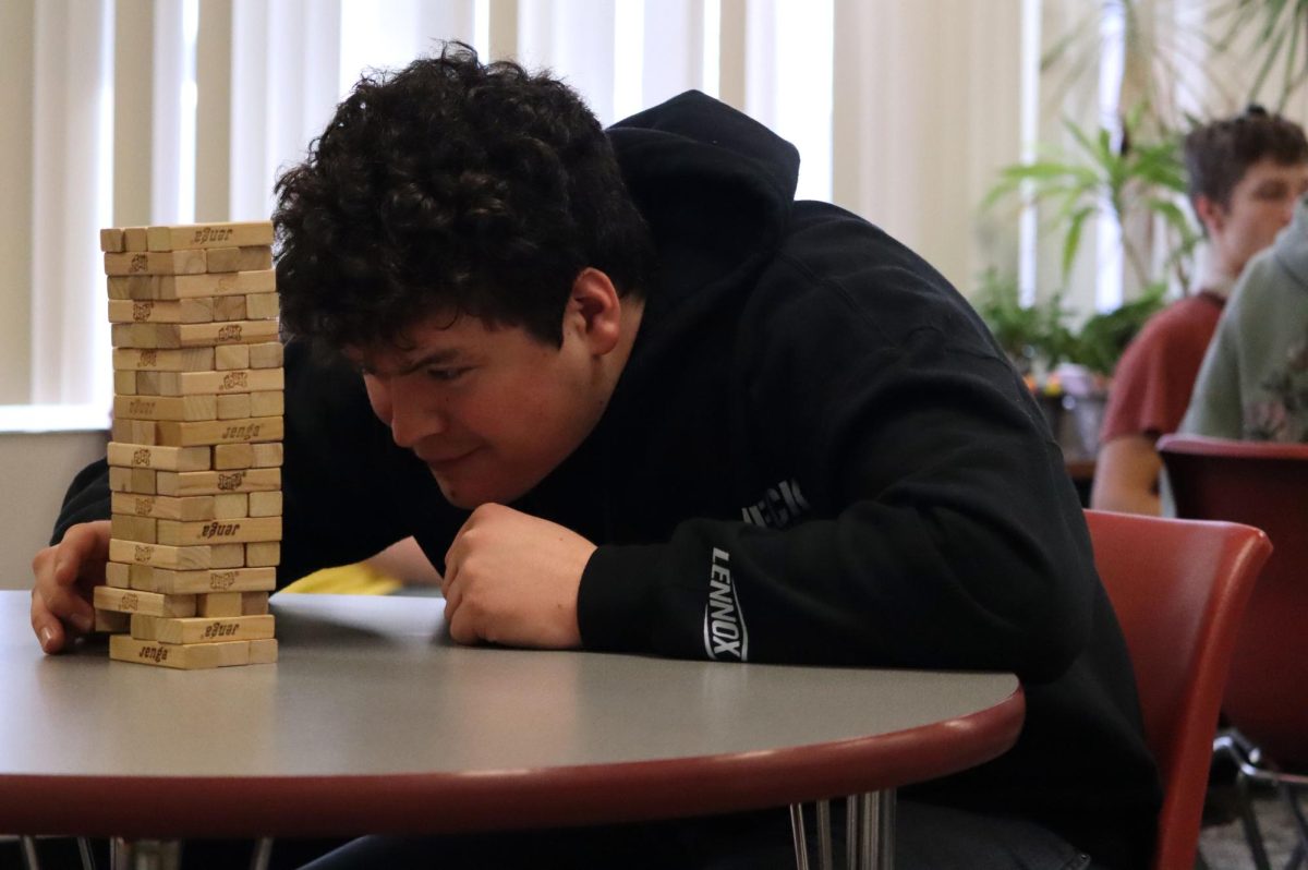 Senior Owen Friess plays Jenga in the Battle of the Classes. Friess got second place. 