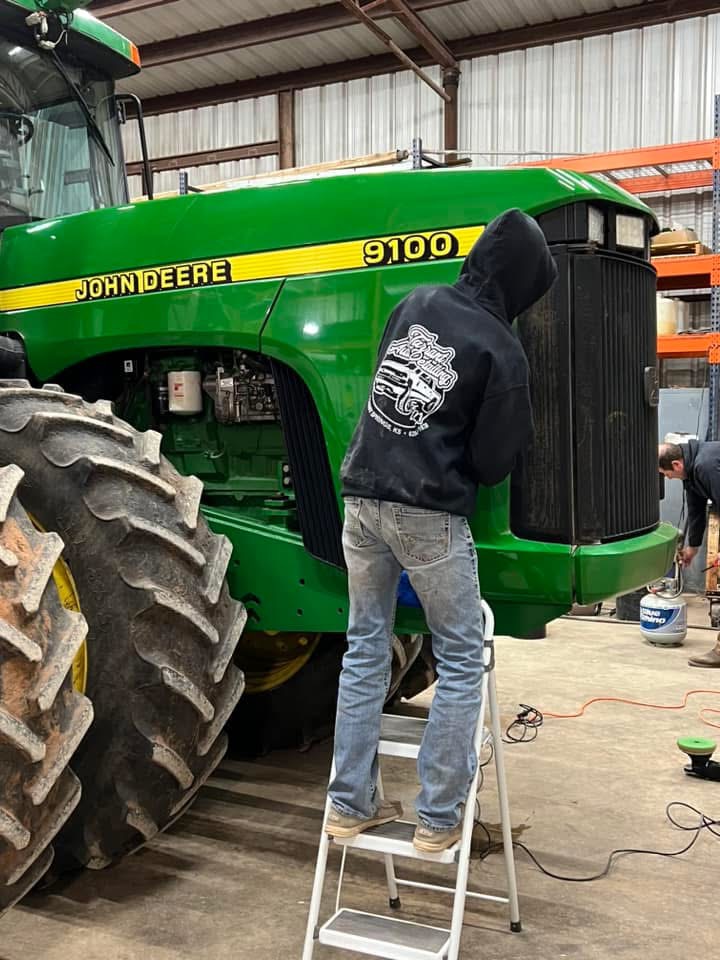 At Tarrant auto detailing there is a number of vehicles they clean. Senior Gage Schmidt cleans a green John Deere tractor.