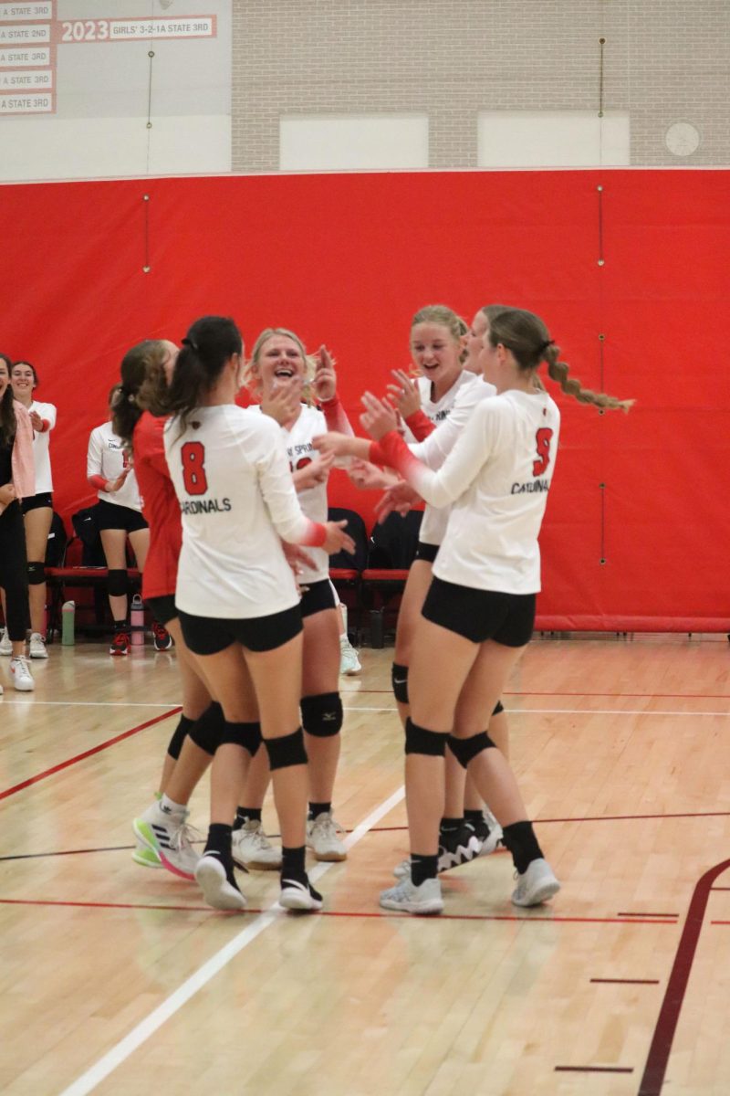 The volleyball team celebrates after an ace. The team lost 2-3 against the Central Plains Oilers Sept. 16.
