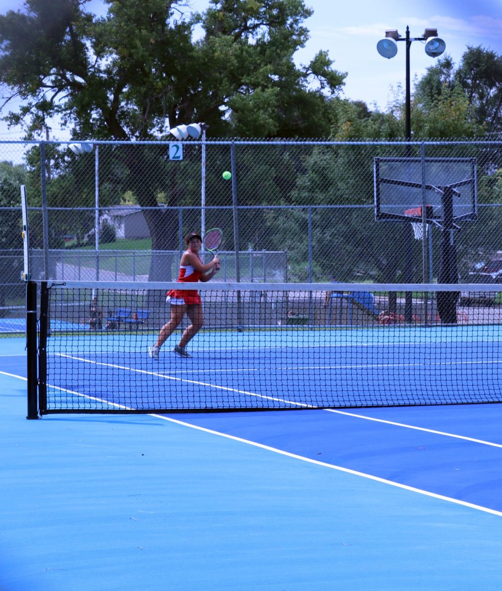At the Pratt tennis meet, senior Aliette Potts hits a shot to win the point. Potts had many long rallies during the match, which lasted over an hour and a half.