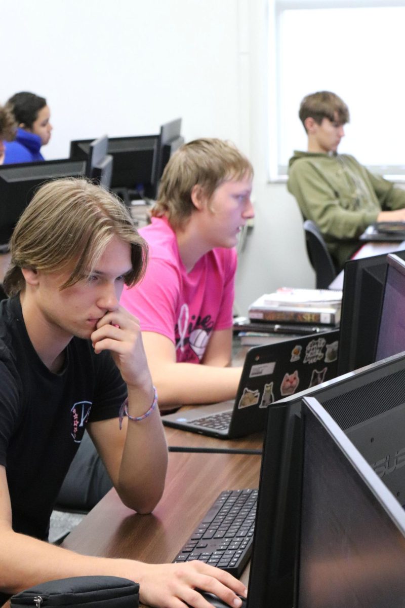 In first hour Financial Literacy, junior Lucas Pauly works on his assignment. Financial Literacy taught the student basic financial concepts to use in the future.