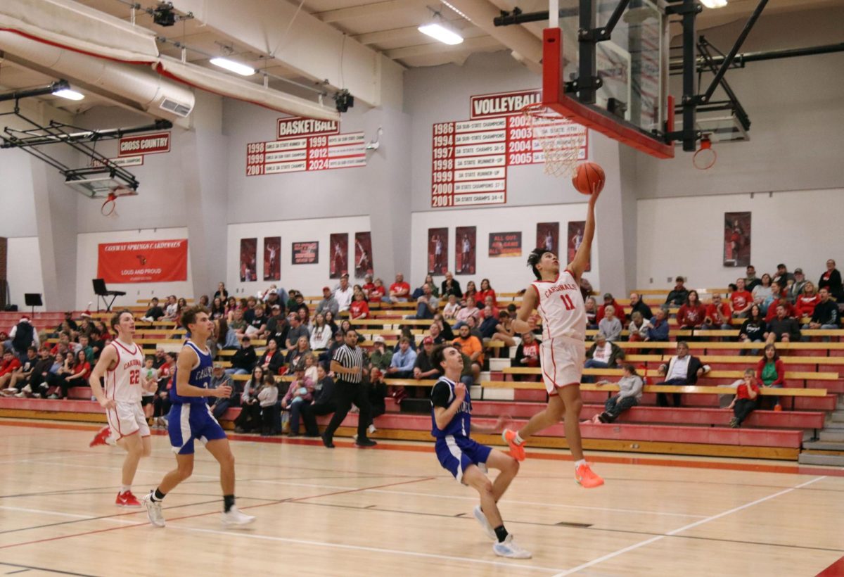 At the Dec. 16 game against Caldwell junior Hayden Frederick goes up for the layup. The final score was 68-35. 
