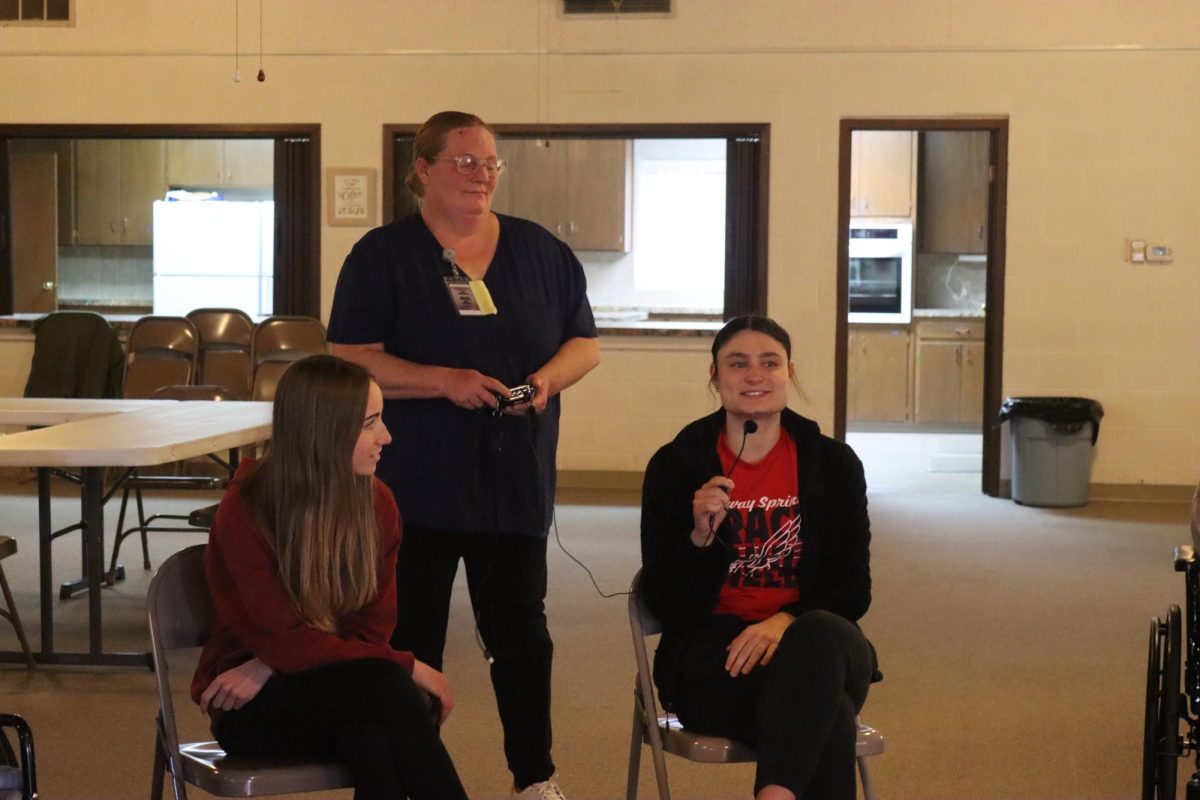 At the Methodist Church, juniors Delaney Jones and Addison Rusco play games with the residents of the nursing home. The game was Two Truths and a Lie.