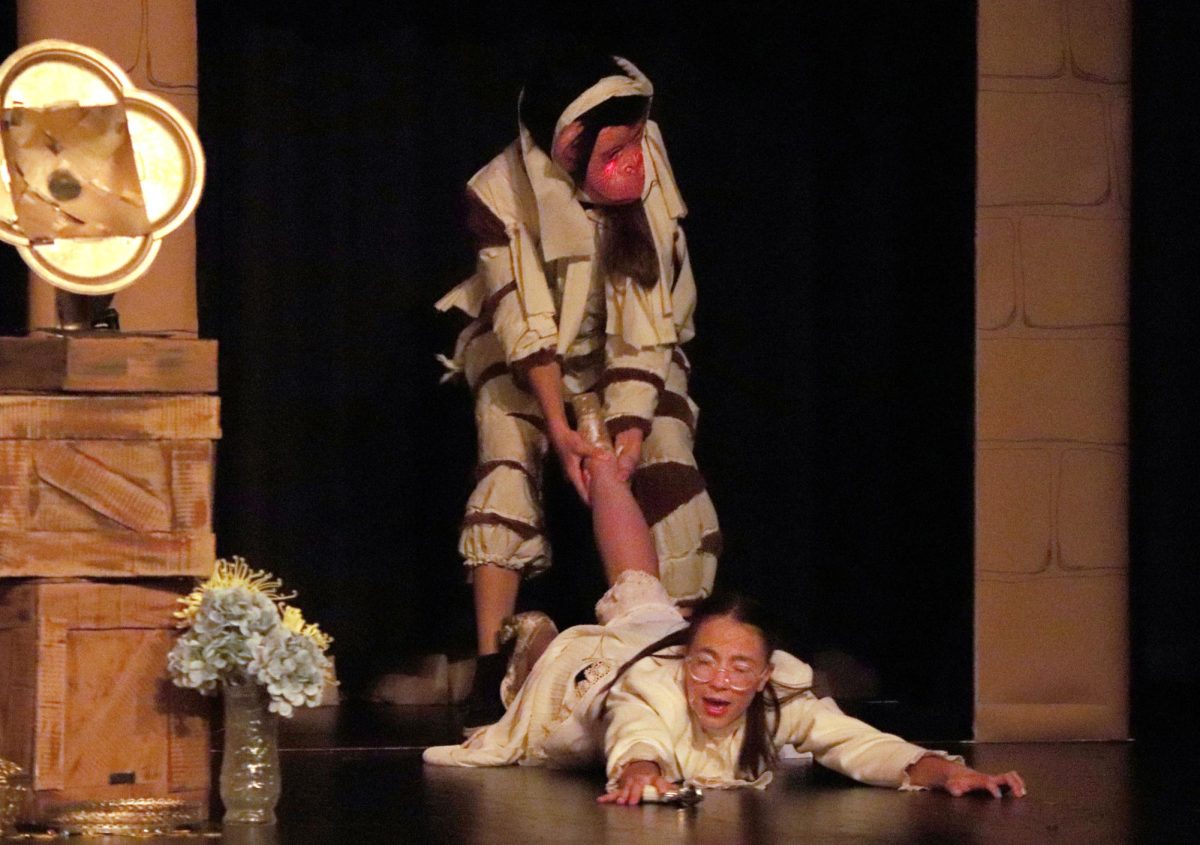 After the portal had been opened, the Mumkey, played by freshman Klara Ast, drags Brenda Brundles, played by senior Sydney Zoglmann, into the Netherworld. "Tuesdays with Mummy" was performed March 27 and 28. 